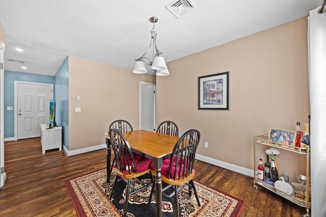 dining area featuring dark hardwood / wood-style floors