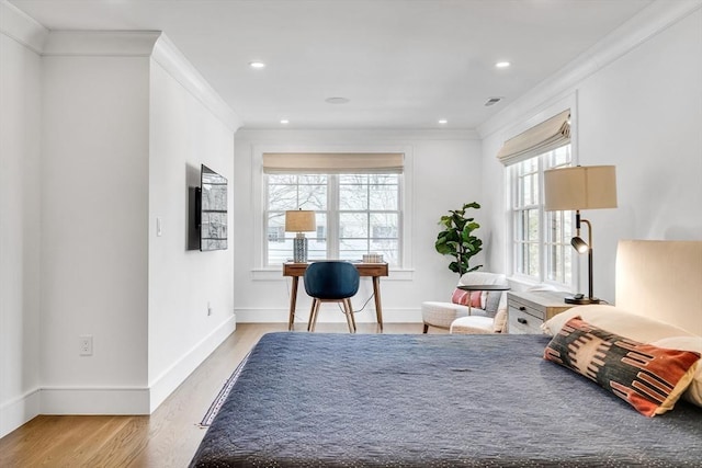 bedroom with visible vents, crown molding, baseboards, light wood-type flooring, and recessed lighting