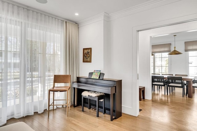 living area featuring recessed lighting, parquet floors, and crown molding