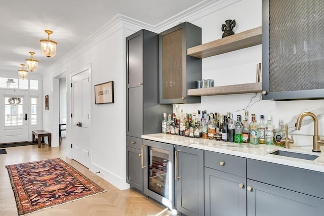 bar with bar, ornamental molding, beverage cooler, and a sink