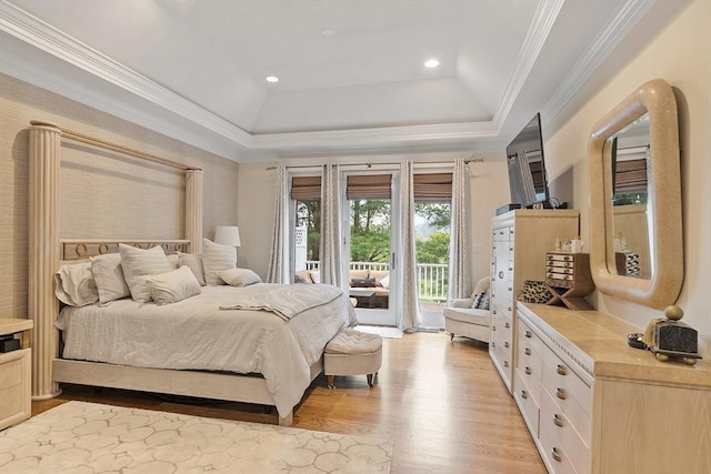 bedroom featuring access to outside, light wood finished floors, a raised ceiling, crown molding, and recessed lighting