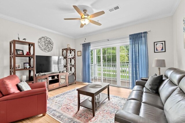 57 Long Point Rd Unit 110, Lakeville, MA 02347 - living room with light wood-style flooring, ceiling fan, crown molding, and baseboards