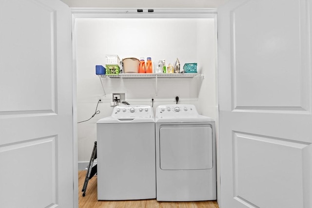 57 Long Point Rd Unit 110, Lakeville, MA 02347 - laundry room with independent washer and dryer and light wood-style floors