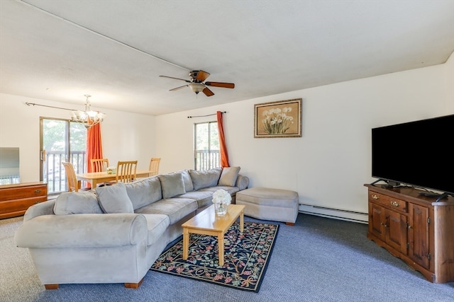 living room featuring ceiling fan with notable chandelier, baseboard heating, plenty of natural light, and carpet floors