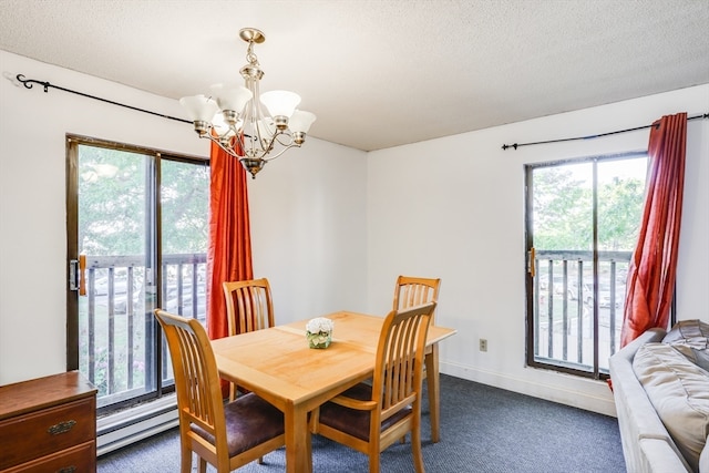 carpeted dining area with a baseboard radiator, a textured ceiling, a wealth of natural light, and an inviting chandelier