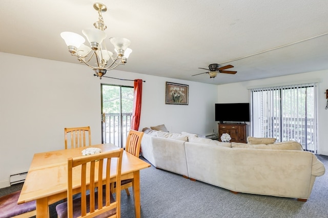 carpeted dining space with a baseboard radiator and ceiling fan with notable chandelier