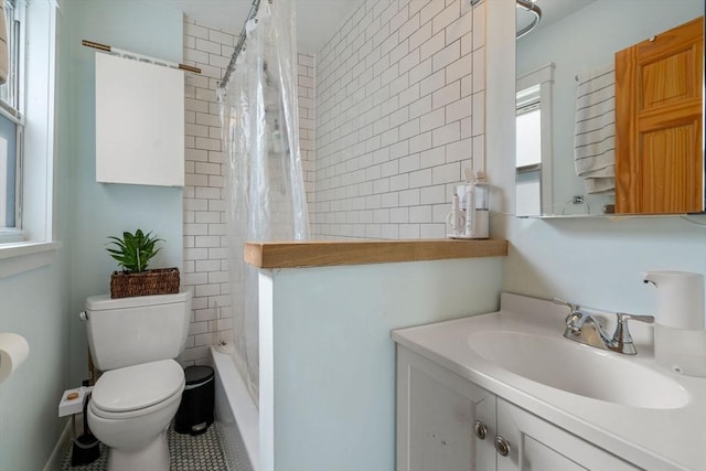 bathroom featuring toilet and vanity