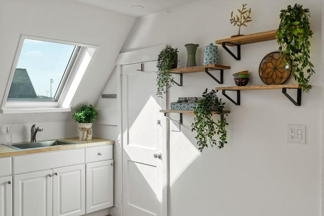 interior space featuring a skylight and a sink