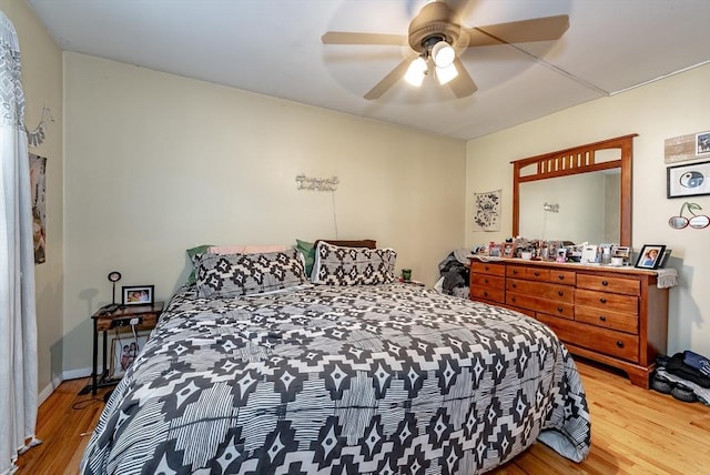 bedroom featuring ceiling fan and wood finished floors