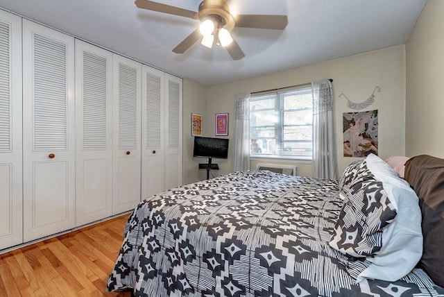 bedroom featuring a closet, ceiling fan, and light wood finished floors