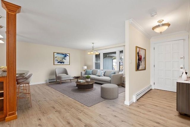 living room featuring baseboards, ornamental molding, baseboard heating, light wood-style floors, and a notable chandelier