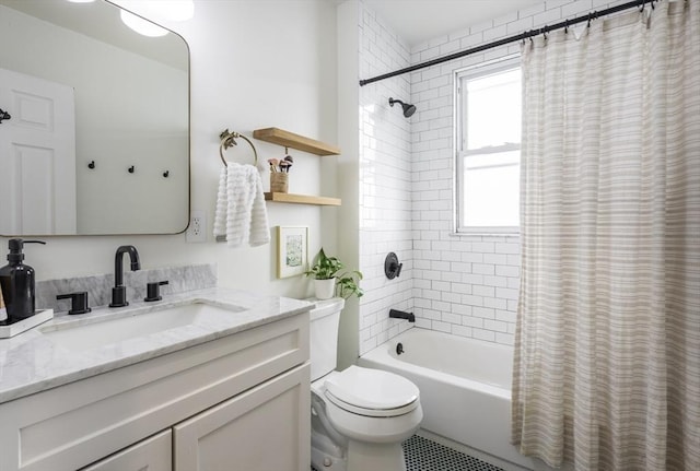 full bathroom featuring shower / bath combo with shower curtain, vanity, and toilet