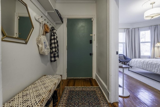 mudroom featuring wood finished floors and ornamental molding