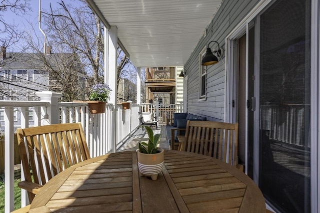 deck with outdoor dining area