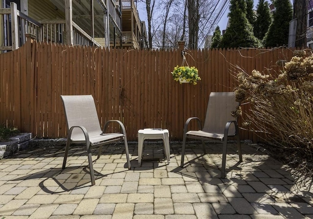 view of patio featuring fence
