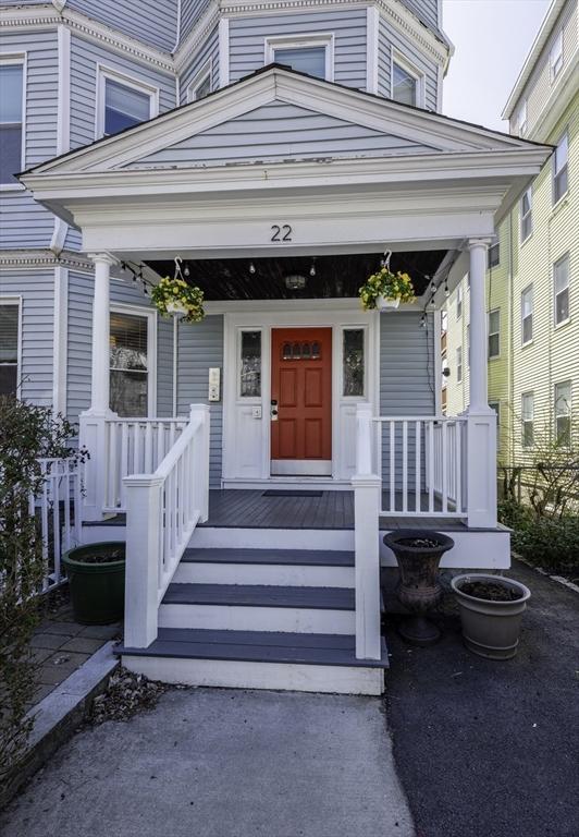 view of exterior entry with a porch