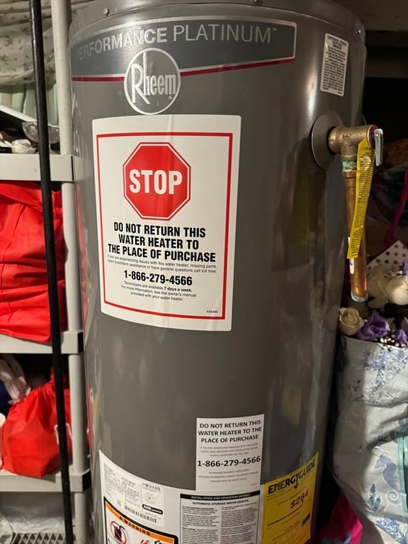 utility room featuring water heater