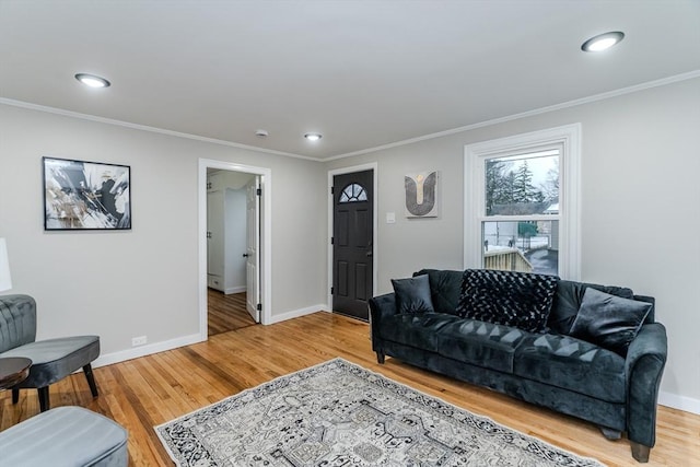 living room featuring crown molding and hardwood / wood-style flooring