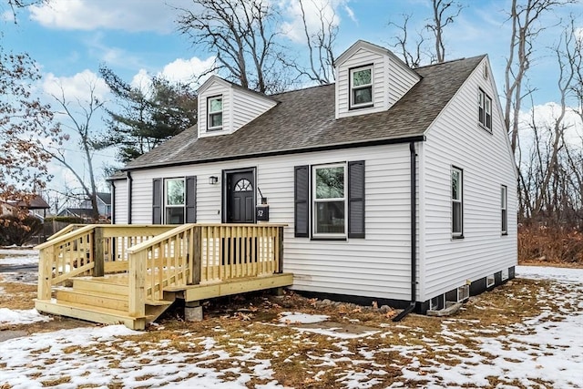 new england style home with a wooden deck