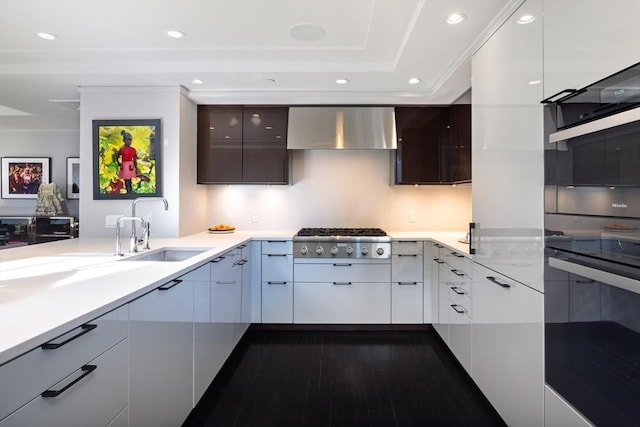 kitchen featuring white cabinetry, sink, stainless steel gas cooktop, ventilation hood, and ornamental molding