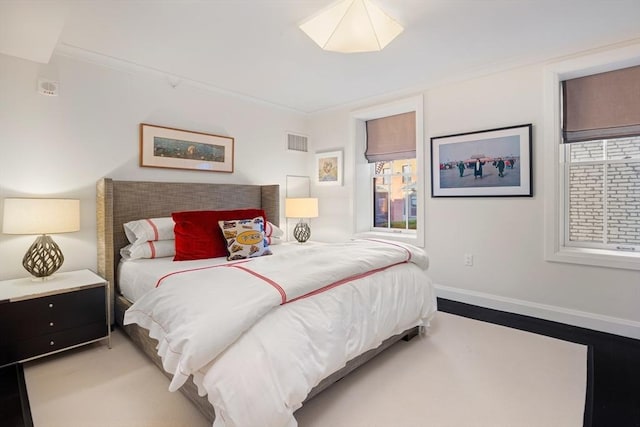 bedroom featuring crown molding