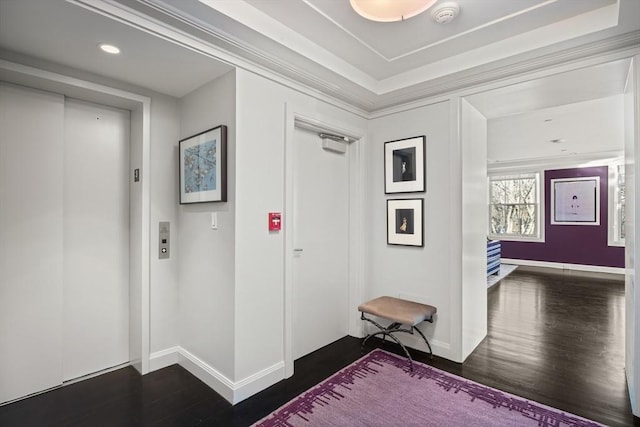 foyer with elevator and dark wood-type flooring