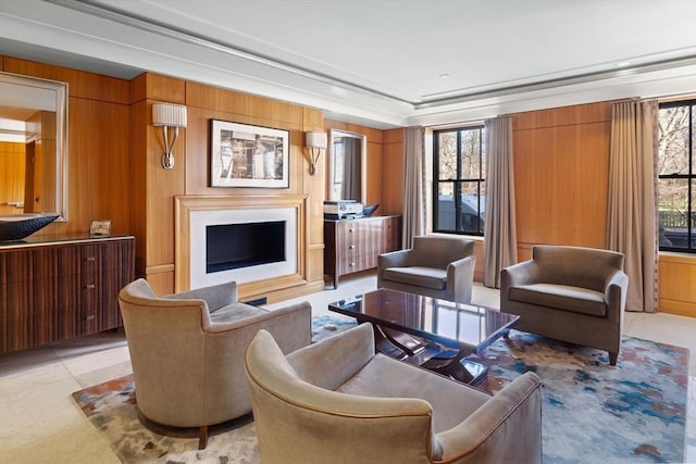 living room with light tile patterned floors and wooden walls