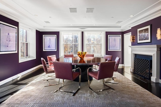 dining area featuring ornamental molding and a healthy amount of sunlight