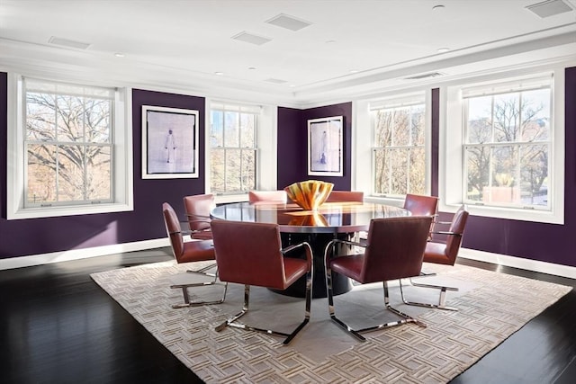 dining space featuring dark wood-type flooring