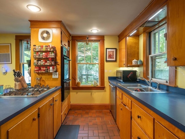 303 S St, Northampton, MA 01060 - kitchen with a sink, baseboards, brick floors, appliances with stainless steel finishes, and dark countertops