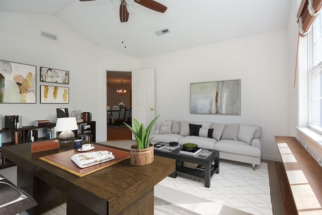 living room featuring plenty of natural light, lofted ceiling, and visible vents
