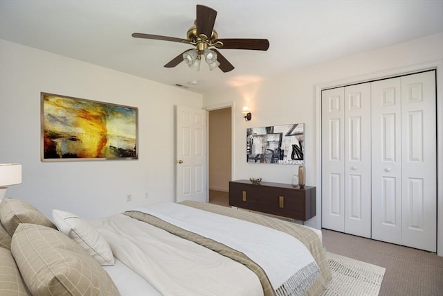 bedroom featuring a closet, carpet flooring, and ceiling fan