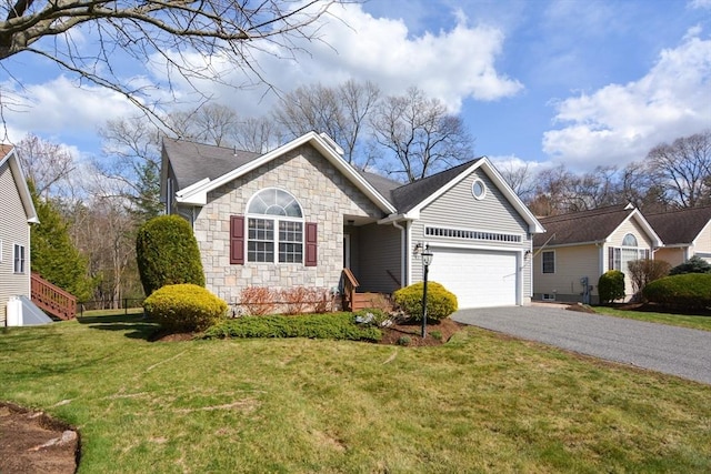ranch-style house featuring aphalt driveway, a front lawn, stone siding, and a garage