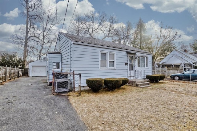 view of front of home with an outbuilding and a garage