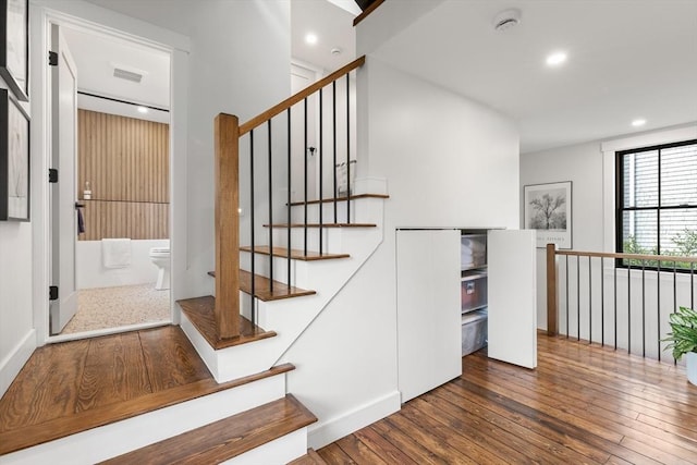 9 Upland Rd, Marblehead, MA 01945 - staircase featuring hardwood / wood-style floors and recessed lighting
