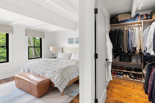 9 Upland Rd, Marblehead, MA 01945 - bedroom with beamed ceiling, hardwood / wood-style floors, baseboards, and a closet