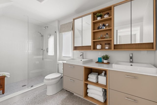 9 Upland Rd, Marblehead, MA 01945 - full bathroom with a stall shower, toilet, double vanity, and speckle patterned floor