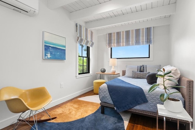 9 Upland Rd, Marblehead, MA 01945 - bedroom featuring an AC wall unit, wood finished floors, beamed ceiling, and baseboards
