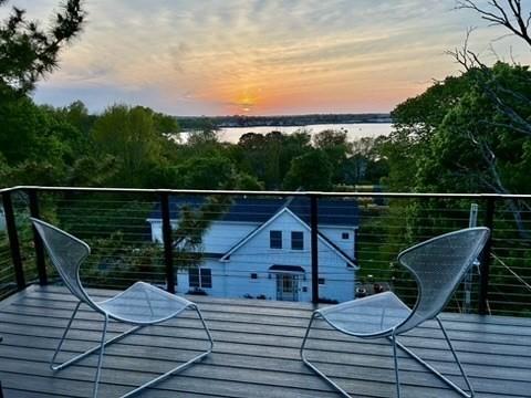 9 Upland Rd, Marblehead, MA 01945 - balcony at dusk featuring a water view