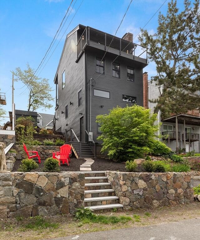 9 Upland Rd, Marblehead, MA 01945 - view of front of house with a chimney and stairs