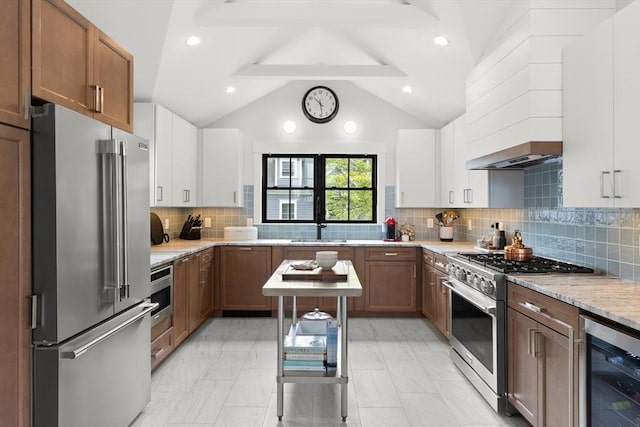 9 Upland Rd, Marblehead, MA 01945 - kitchen with premium appliances, beverage cooler, a sink, and white cabinetry