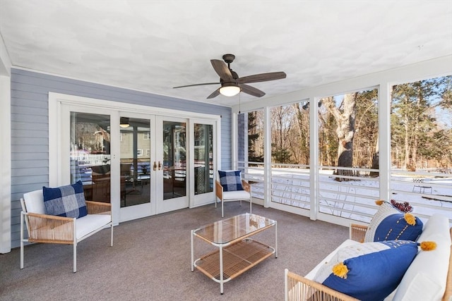 sunroom / solarium with ceiling fan and french doors