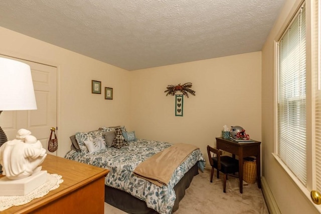 20 Starling Way, Leominster, MA 01453 - bedroom with light colored carpet, a textured ceiling, and baseboard heating