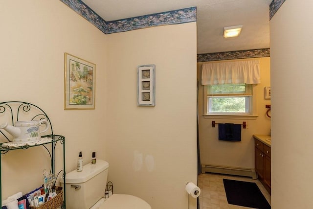 20 Starling Way, Leominster, MA 01453 - bathroom featuring a baseboard radiator, toilet, vanity, and tile patterned floors