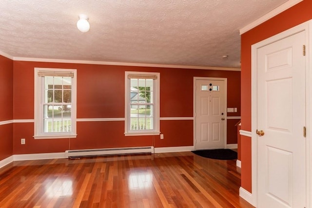 20 Starling Way, Leominster, MA 01453 - foyer entrance featuring a baseboard heating unit, hardwood / wood-style floors, baseboards, plenty of natural light, and ornamental molding