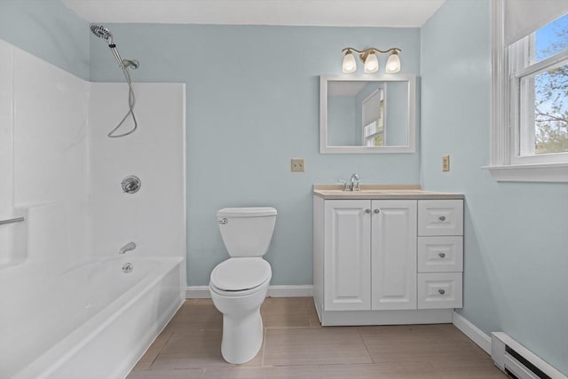 full bath featuring baseboard heating, toilet, baseboards, and vanity