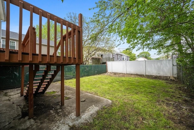 view of yard with stairs and a deck