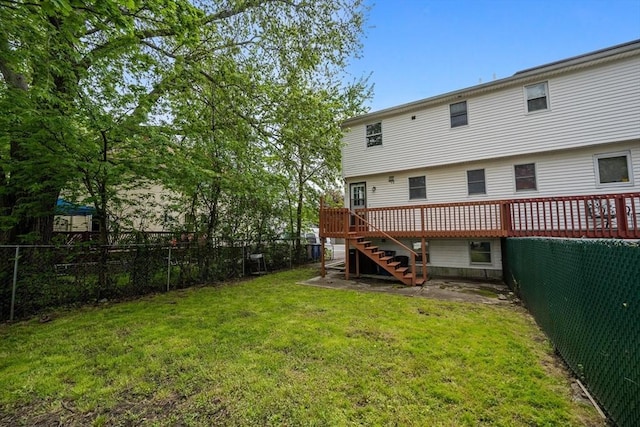 rear view of property with stairs and a wooden deck