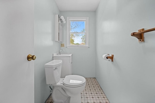 bathroom featuring toilet and a sink