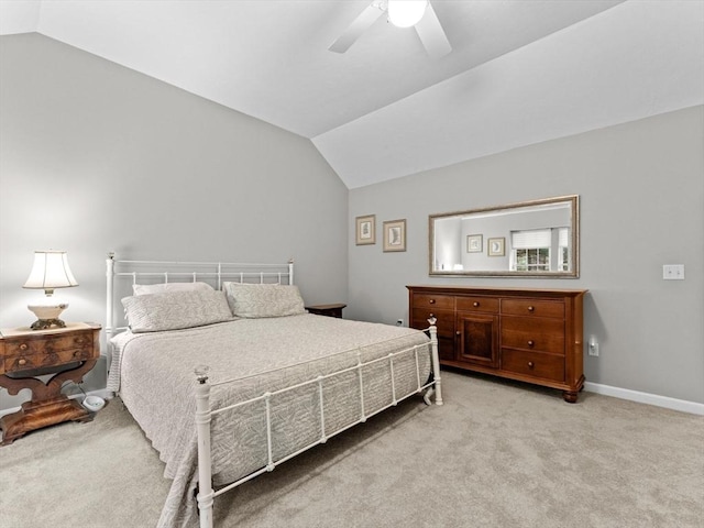carpeted bedroom with lofted ceiling, ceiling fan, and baseboards